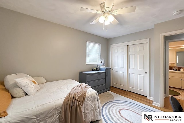 8506 Keystone Dr, Omaha, NE 68134 - bedroom featuring wood finished floors, a closet, and a ceiling fan