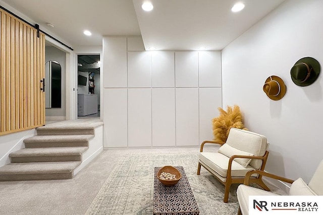 8506 Keystone Dr, Omaha, NE 68134 - living area featuring recessed lighting, light carpet, and a barn door