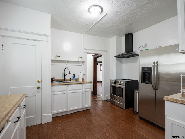 6557 Maple St, Omaha, NE 68104 - kitchen featuring appliances with stainless steel finishes, wall chimney exhaust hood, white cabinets, a textured ceiling, and dark wood-style flooring