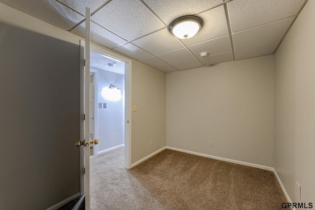 1524 Trumball Ter, Plattsmouth, NE 68048 - spare room featuring carpet floors, a paneled ceiling, and a smoke detector