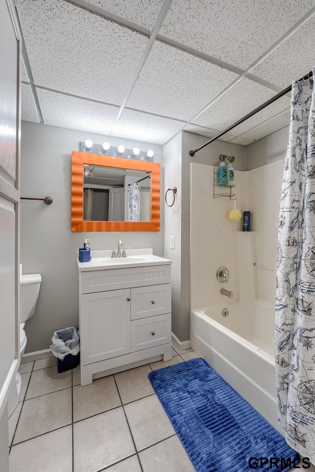 1524 Trumball Ter, Plattsmouth, NE 68048 - full bathroom with a paneled ceiling, shower / bathtub combination with curtain, tile patterned flooring, and vanity