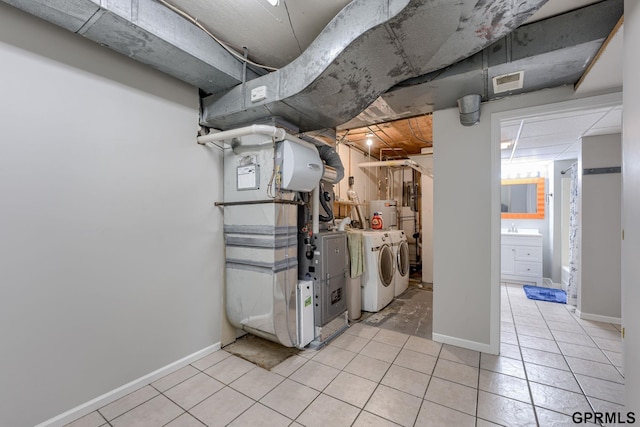 1524 Trumball Ter, Plattsmouth, NE 68048 - unfinished basement with independent washer and dryer, light tile patterned floors, water heater, and heating unit