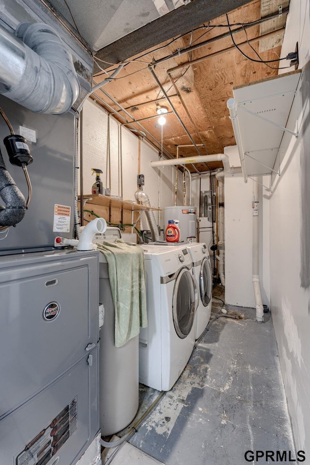 1524 Trumball Ter, Plattsmouth, NE 68048 - laundry room with washer and clothes dryer and heating unit