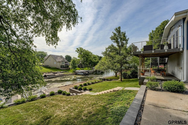 1524 Trumball Ter, Plattsmouth, NE 68048 - view of green lawn with a balcony and a water view