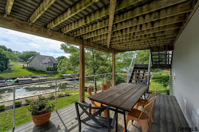 1524 Trumball Ter, Plattsmouth, NE 68048 - wooden terrace with stairs, a water view, a yard, and outdoor dining area