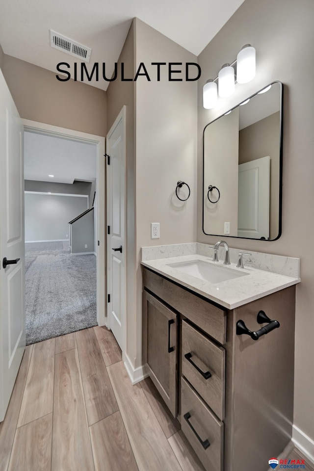 527 N 108th St, Lincoln, NE 68527 - bathroom with vanity and wood finished floors