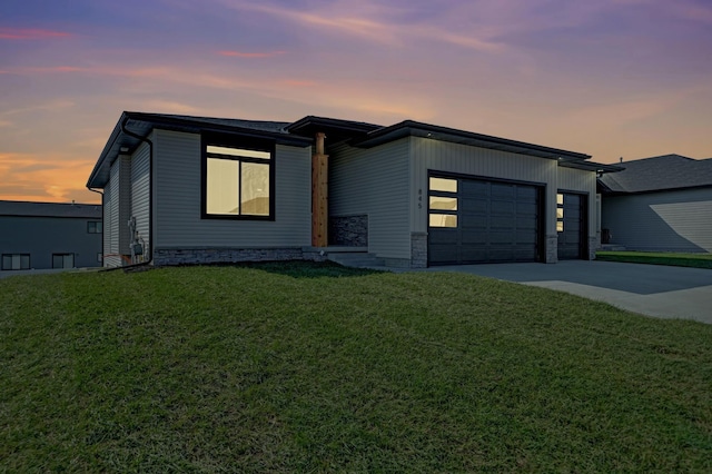 527 N 108th St, Lincoln, NE 68527 - contemporary home with an attached garage, driveway, and a lawn