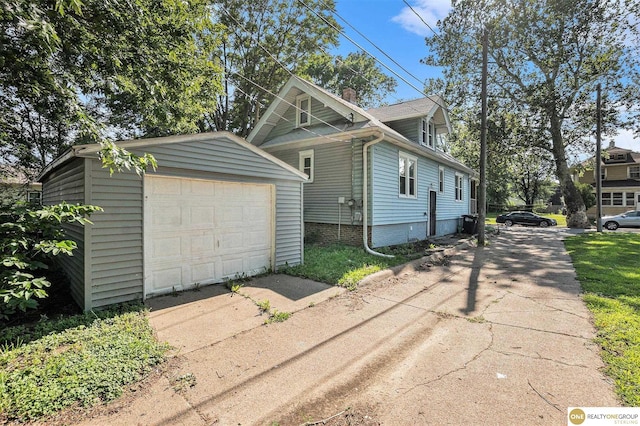 4615 N 28th Ave, Omaha, NE 68111 - view of front of property featuring driveway, an outdoor structure, and a garage