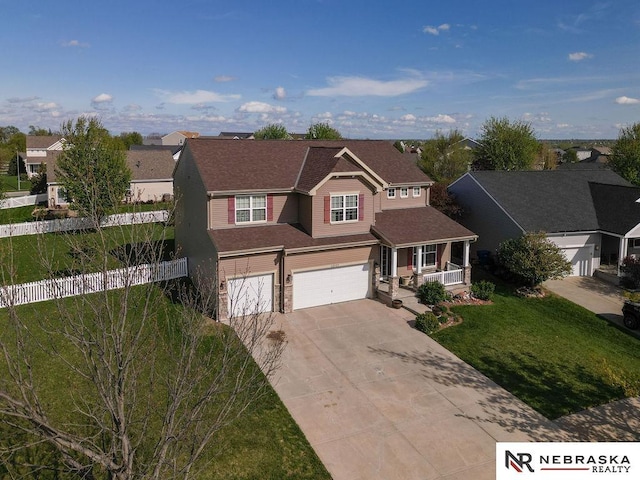 15929 Rosewater Pkwy, Bennington, NE 68007 - view of front of property featuring a porch, a garage, concrete driveway, and a residential view