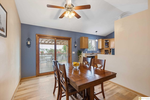 15748 Rosewood St, Omaha, NE 68136 - dining room with light wood finished floors, vaulted ceiling, and a ceiling fan