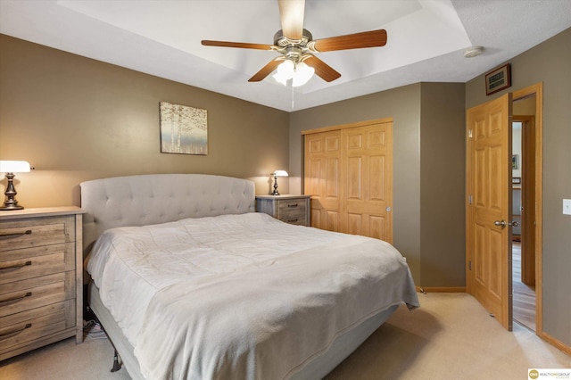 15748 Rosewood St, Omaha, NE 68136 - bedroom featuring light carpet, a closet, and ceiling fan