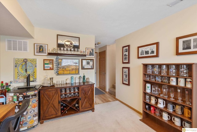 15748 Rosewood St, Omaha, NE 68136 - bar with light colored carpet and baseboards
