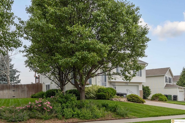 15748 Rosewood St, Omaha, NE 68136 - obstructed view of property featuring a garage and concrete driveway