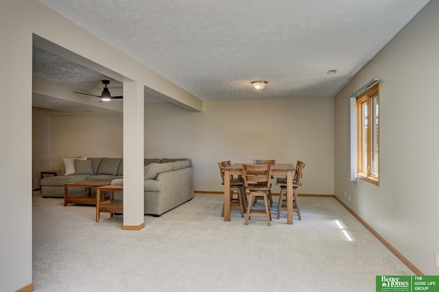 17139 S St, Omaha, NE 68135 - dining area featuring carpet, a textured ceiling, and a ceiling fan