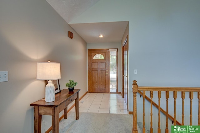 17139 S St, Omaha, NE 68135 - entrance foyer featuring lofted ceiling, light tile patterned flooring, and light carpet