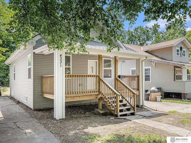 4331 N 41st St, Omaha, NE 68111 - view of front of house featuring roof with shingles and a porch