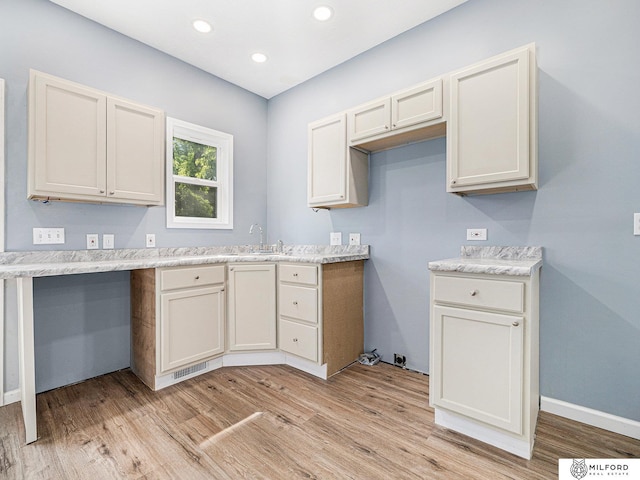 4331 N 41st St, Omaha, NE 68111 - kitchen with light wood-style flooring, light countertops, and recessed lighting