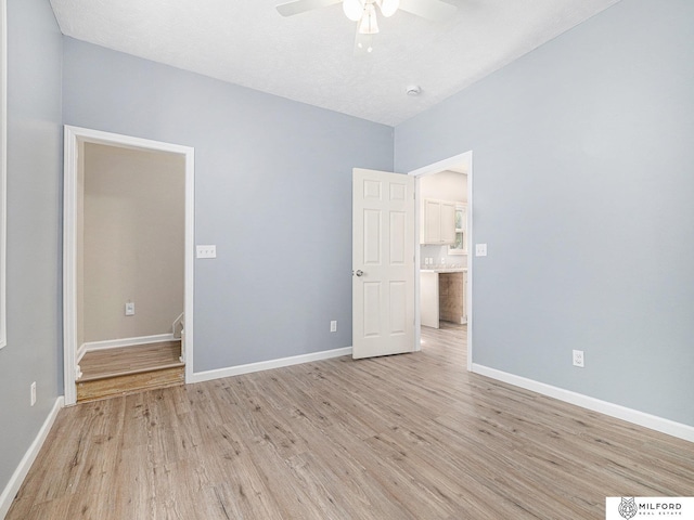 4331 N 41st St, Omaha, NE 68111 - unfurnished bedroom featuring light wood-style flooring and ceiling fan