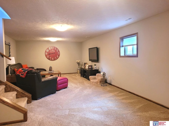 2364 N Columbia Ave, Seward, NE 68434 - carpeted living room with stairs and a textured ceiling