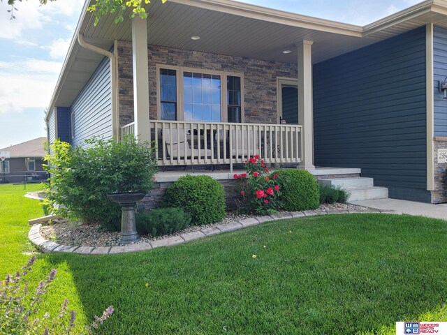 2364 N Columbia Ave, Seward, NE 68434 - doorway to property with a porch and a lawn
