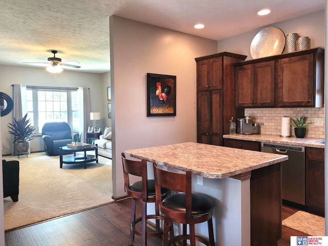 2364 N Columbia Ave, Seward, NE 68434 - kitchen featuring dishwasher, a ceiling fan, light countertops, a kitchen island, and recessed lighting