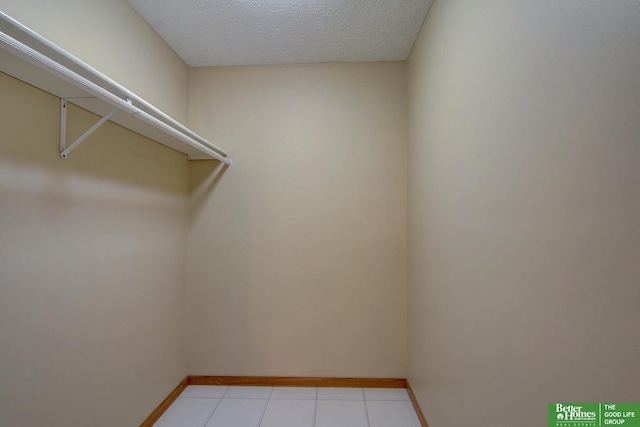 21900 Angus Rd, Gretna, NE 68028 - walk in closet featuring light tile patterned floors