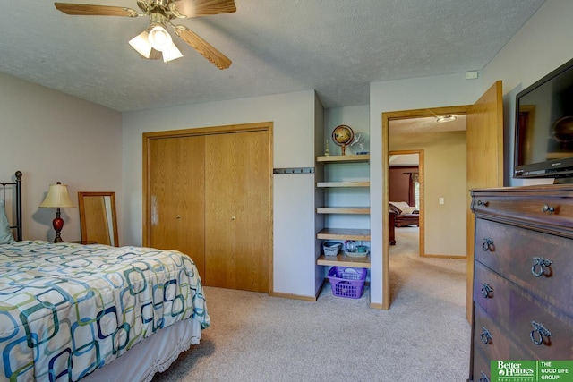 21900 Angus Rd, Gretna, NE 68028 - bedroom featuring a closet, carpet floors, a textured ceiling, and a ceiling fan