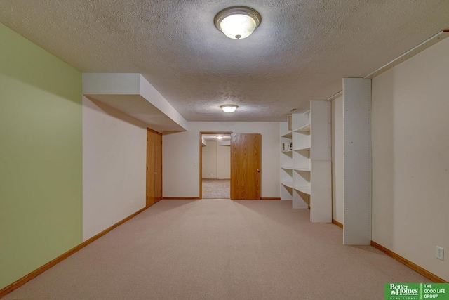 21900 Angus Rd, Gretna, NE 68028 - finished below grade area featuring a textured ceiling and light colored carpet