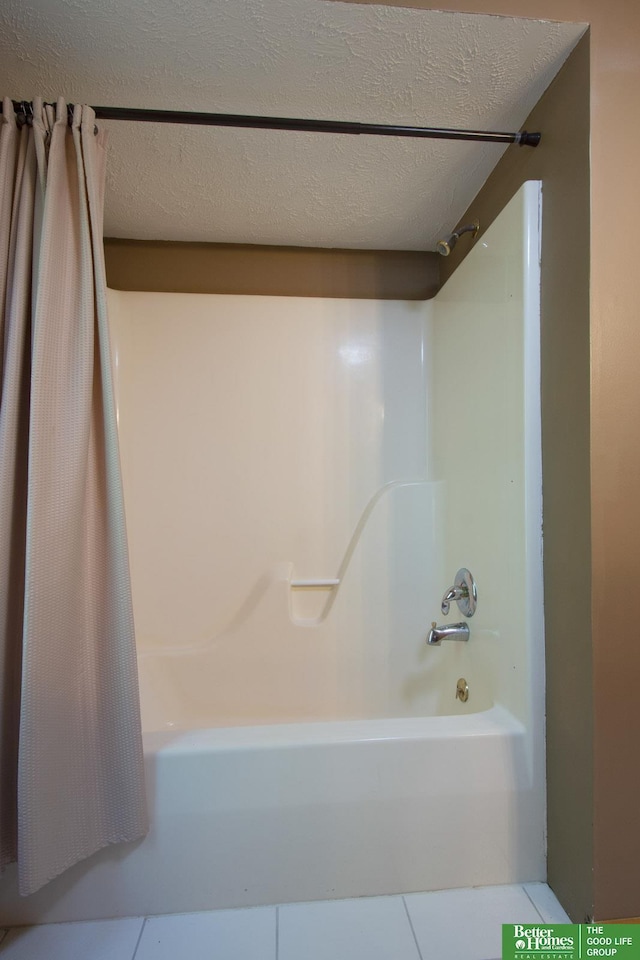 21900 Angus Rd, Gretna, NE 68028 - bathroom featuring shower / bath combination with curtain, tile patterned floors, and a textured ceiling