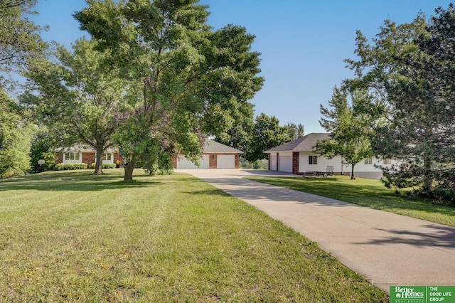 21900 Angus Rd, Gretna, NE 68028 - view of front facade with a front yard and a detached garage