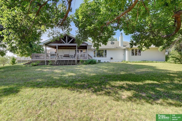 21900 Angus Rd, Gretna, NE 68028 - back of property featuring a yard, a chimney, and a deck