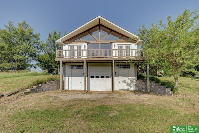 21900 Angus Rd, Gretna, NE 68028 - view of front facade with a wooden deck, french doors, a front lawn, and an attached garage