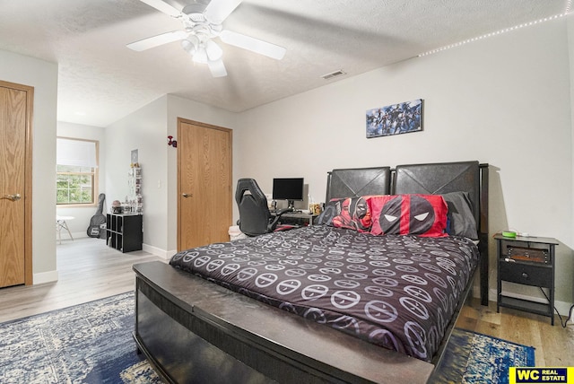 2810 Westridge Dr, Blair, NE 68008 - bedroom with wood finished floors, a textured ceiling, and ceiling fan