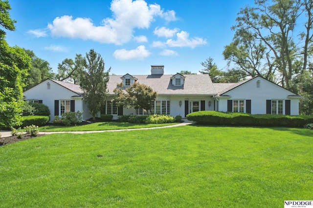1705 N 102nd St, Omaha, NE 68114 - view of front of house with a front yard, a chimney, and a tiled roof