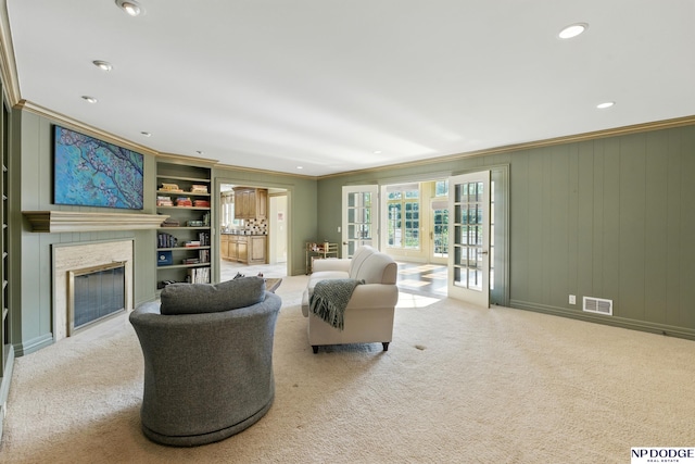 1705 N 102nd St, Omaha, NE 68114 - carpeted living area with ornamental molding, a fireplace, recessed lighting, and built in features