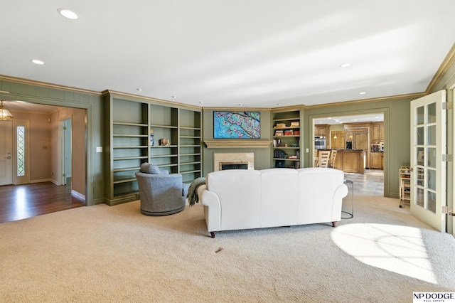 1705 N 102nd St, Omaha, NE 68114 - living room with ornamental molding, carpet floors, recessed lighting, a fireplace, and french doors