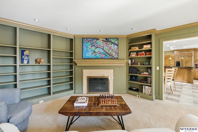 1705 N 102nd St, Omaha, NE 68114 - living room with light colored carpet, built in shelves, ornamental molding, a premium fireplace, and recessed lighting