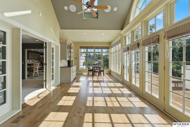 1705 N 102nd St, Omaha, NE 68114 - sunroom featuring high vaulted ceiling, healthy amount of natural light, french doors, wood finished floors, and recessed lighting