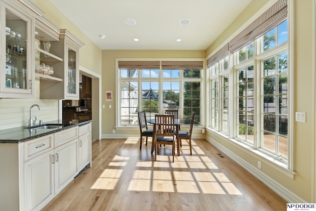 1705 N 102nd St, Omaha, NE 68114 - sunroom featuring plenty of natural light, wood finished floors, recessed lighting, and french doors