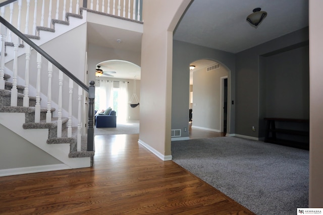 11915 S 53rd St, Papillion, NE 68133 - entryway featuring wood finished floors, arched walkways, ceiling fan, and stairs