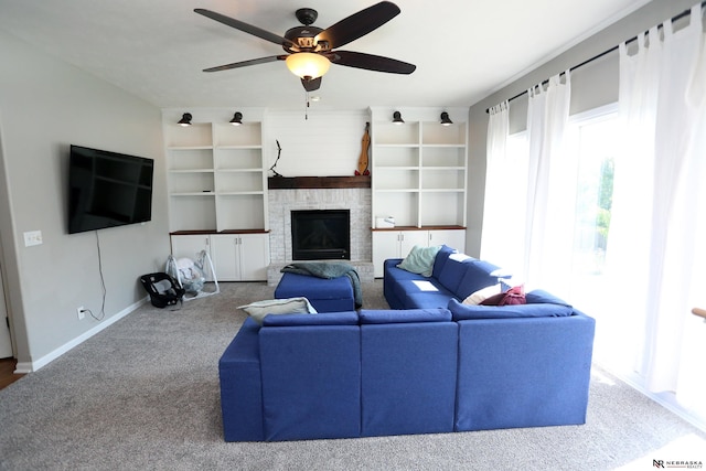 11915 S 53rd St, Papillion, NE 68133 - living room with a ceiling fan, a fireplace, built in features, and carpet