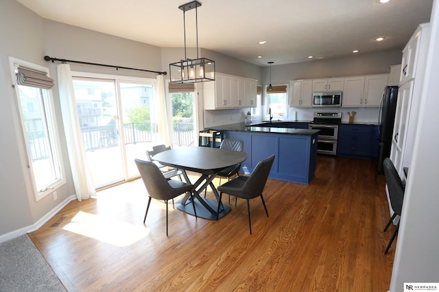 11915 S 53rd St, Papillion, NE 68133 - dining space featuring dark wood-style floors, recessed lighting, and a chandelier