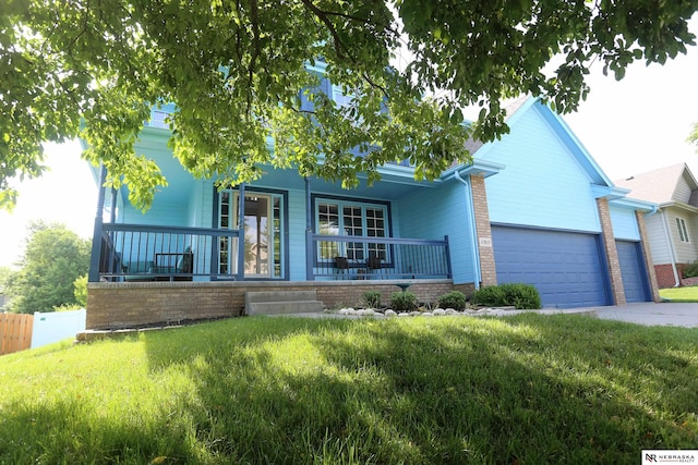 11915 S 53rd St, Papillion, NE 68133 - view of front of property featuring a porch, an attached garage, and driveway