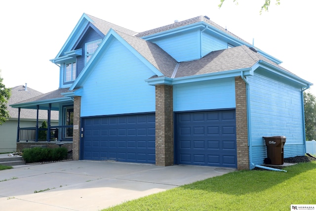 11915 S 53rd St, Papillion, NE 68133 - view of front of home featuring roof with shingles, an attached garage, driveway, brick siding, and a porch
