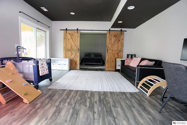 11915 S 53rd St, Papillion, NE 68133 - living room with a barn door, wood finished floors, and recessed lighting