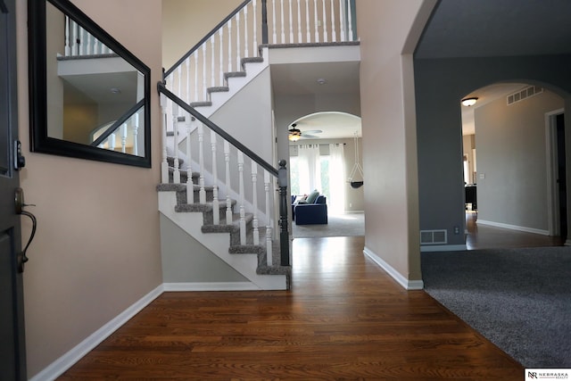 11915 S 53rd St, Papillion, NE 68133 - foyer entrance with arched walkways, ceiling fan, wood finished floors, and stairway