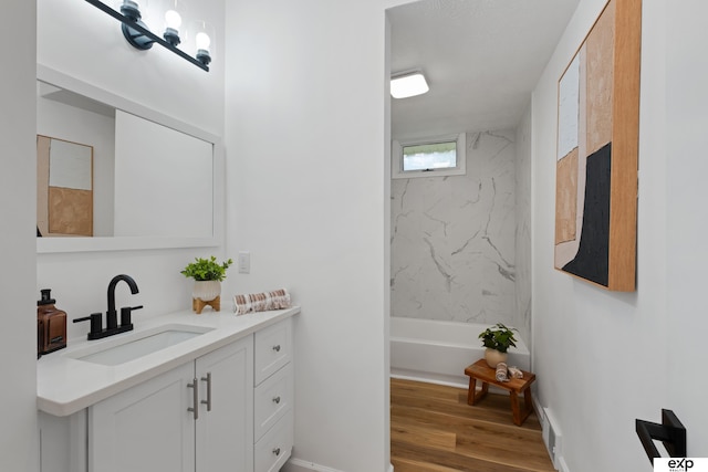 3279 Hascall St, Omaha, NE 68105 - full bathroom featuring vanity, wood finished floors, and bathtub / shower combination