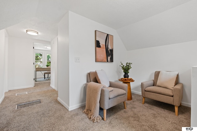 3279 Hascall St, Omaha, NE 68105 - sitting room featuring carpet flooring and vaulted ceiling