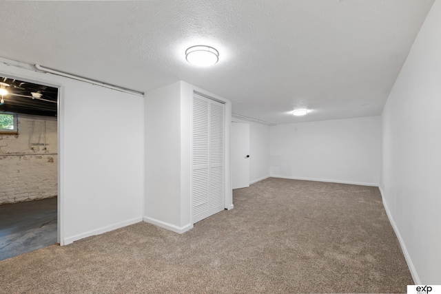 3279 Hascall St, Omaha, NE 68105 - finished basement with carpet and a textured ceiling