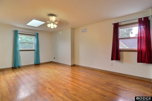 405 W 20th St, Fremont, NE 68025 - unfurnished room featuring light wood-type flooring, a ceiling fan, and a skylight